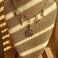 Heading south charm necklace