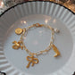 The Golden Cowgirl charm bracelet