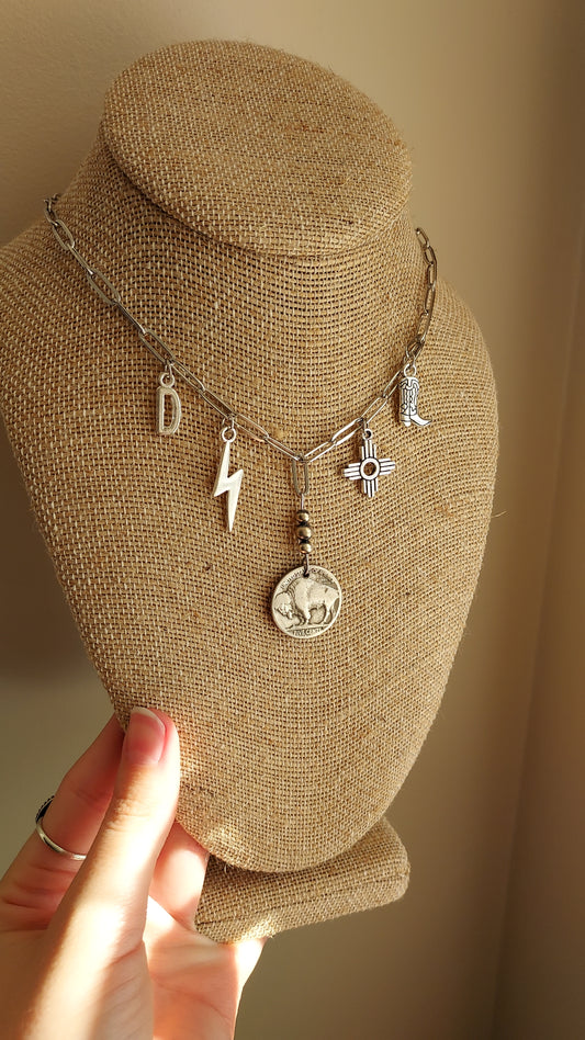 Heading south charm necklace