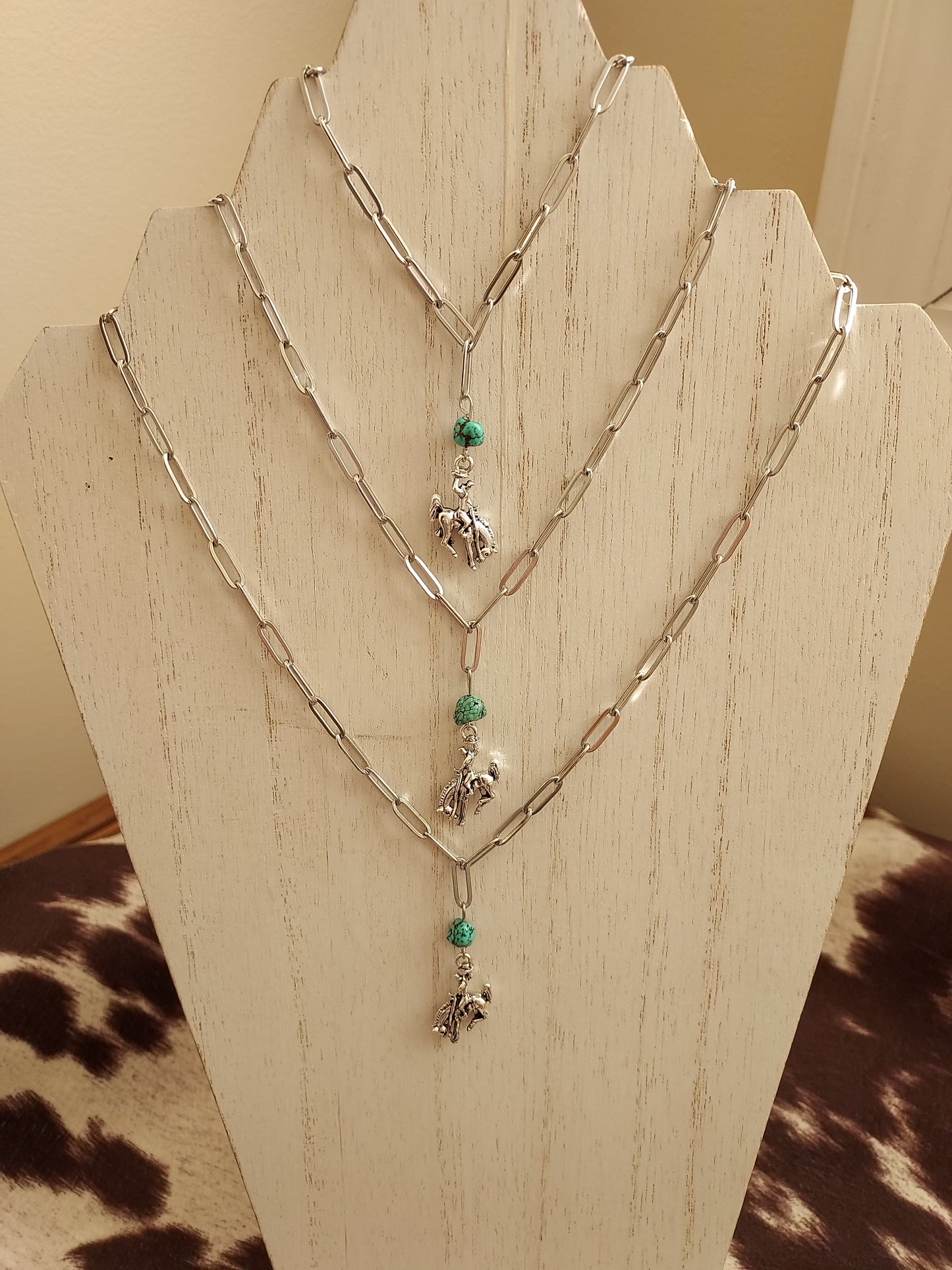 Bucking cowboy necklace